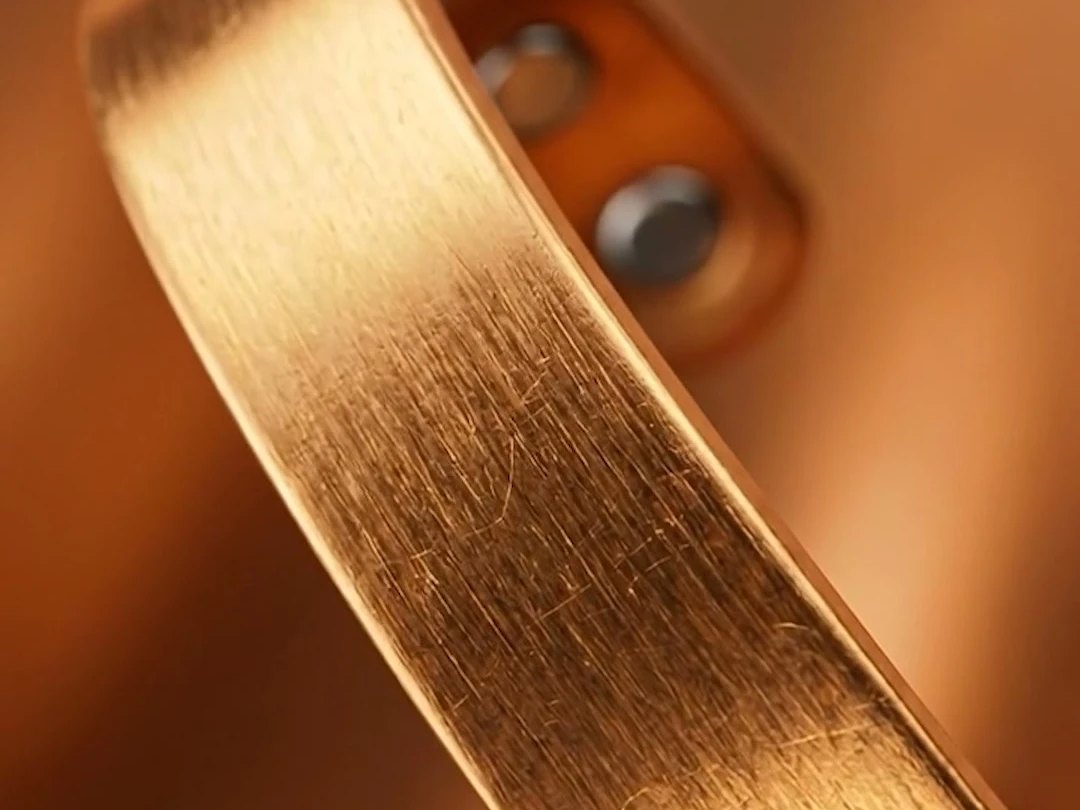 Close-up of the Quantum Bracelet's copper surface, band, and magnetic ends
