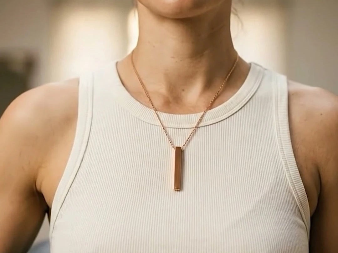 The Quantum copper necklace worn in soft morning light