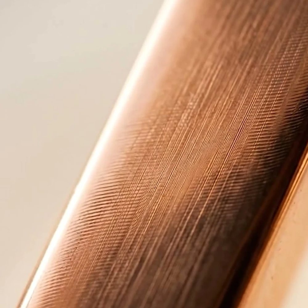 Macro view of the copper-finished Quantum Necklace fitting