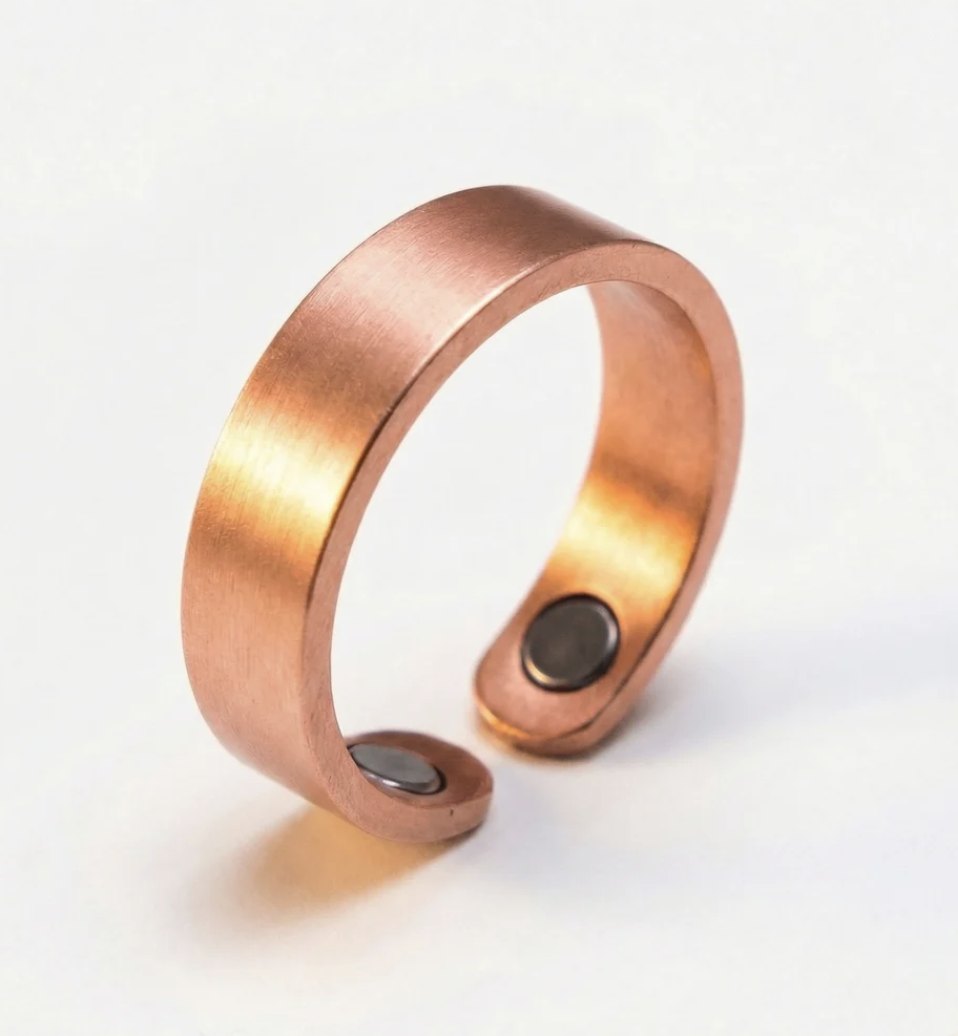 Close view of the Quantum EMF Ring's softly brushed copper surface and interior magnets